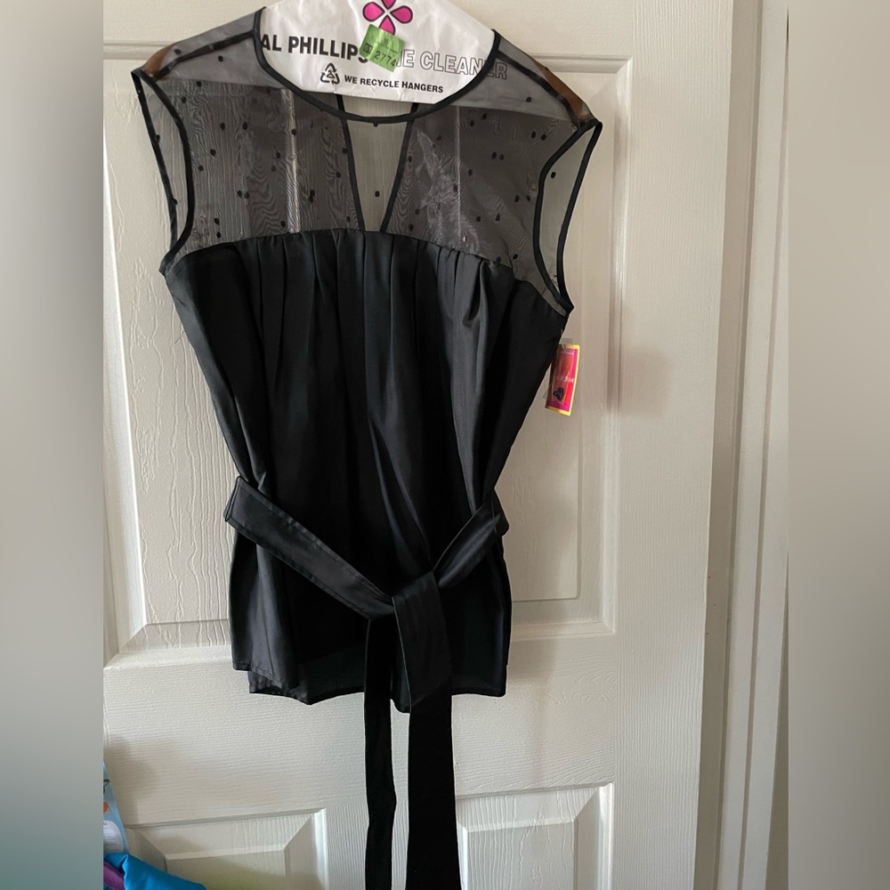 Beautiful Black top with tie waist and top embossed with dots.